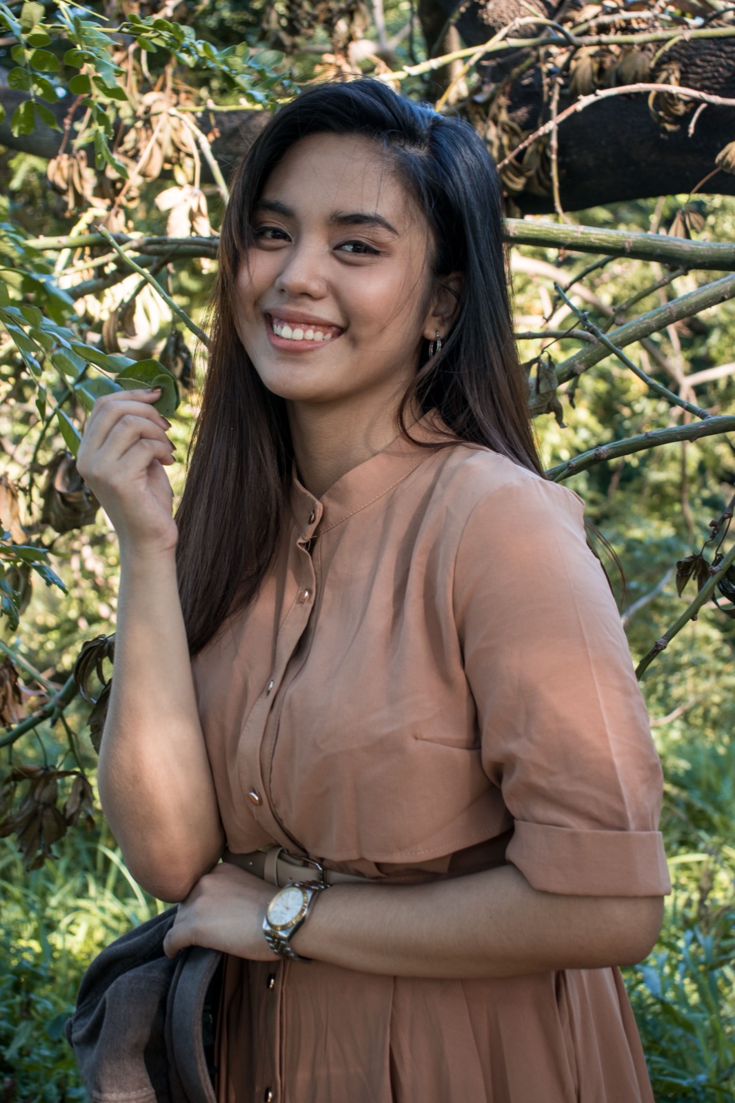 Illustrative stock photo of a smiling Filipina woman in a garden