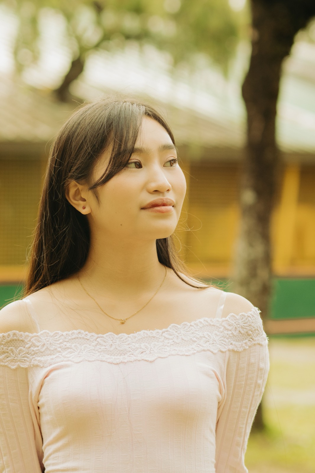 Illustrative photo of a Filipina woman in a white lace top